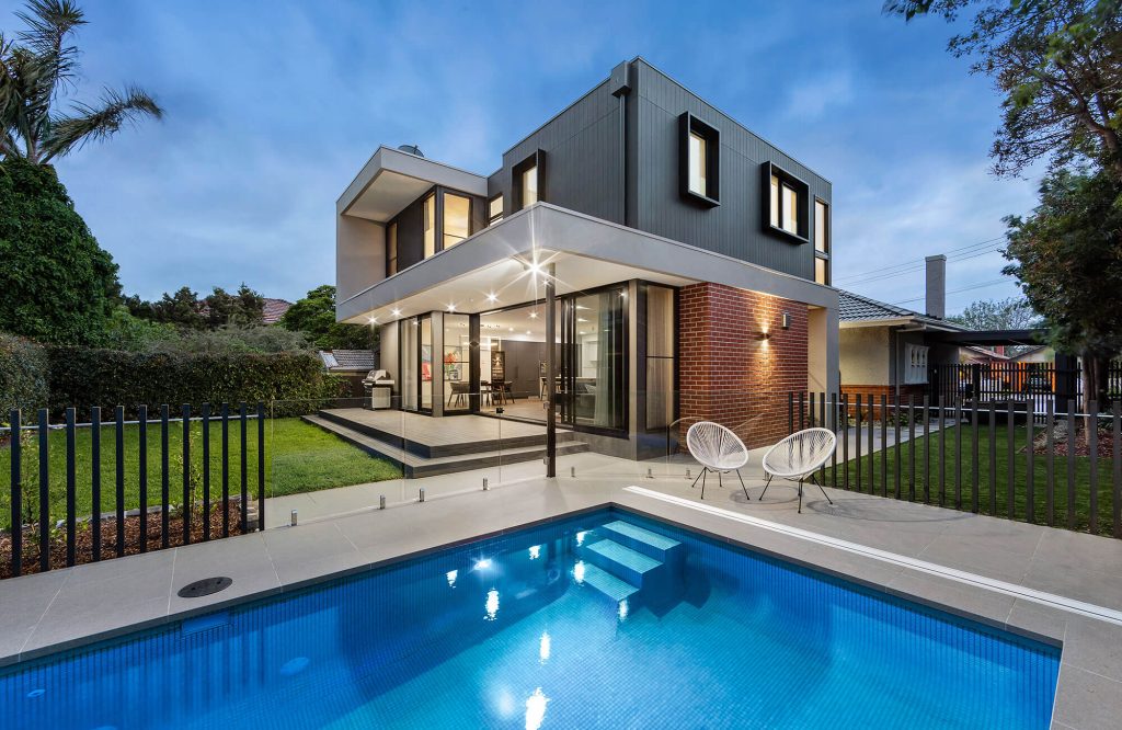 Renovated home exterior with updated siding and clean architectural lines
