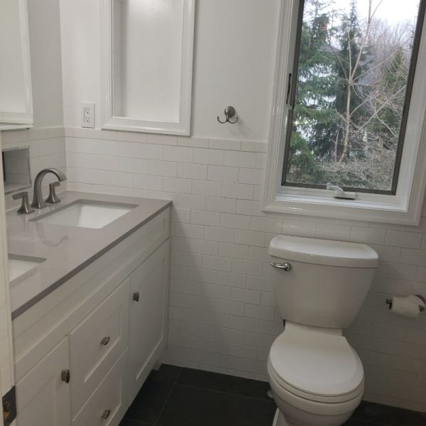 Cleaned washroom tiles, showing the result of professional tile cleaning services.